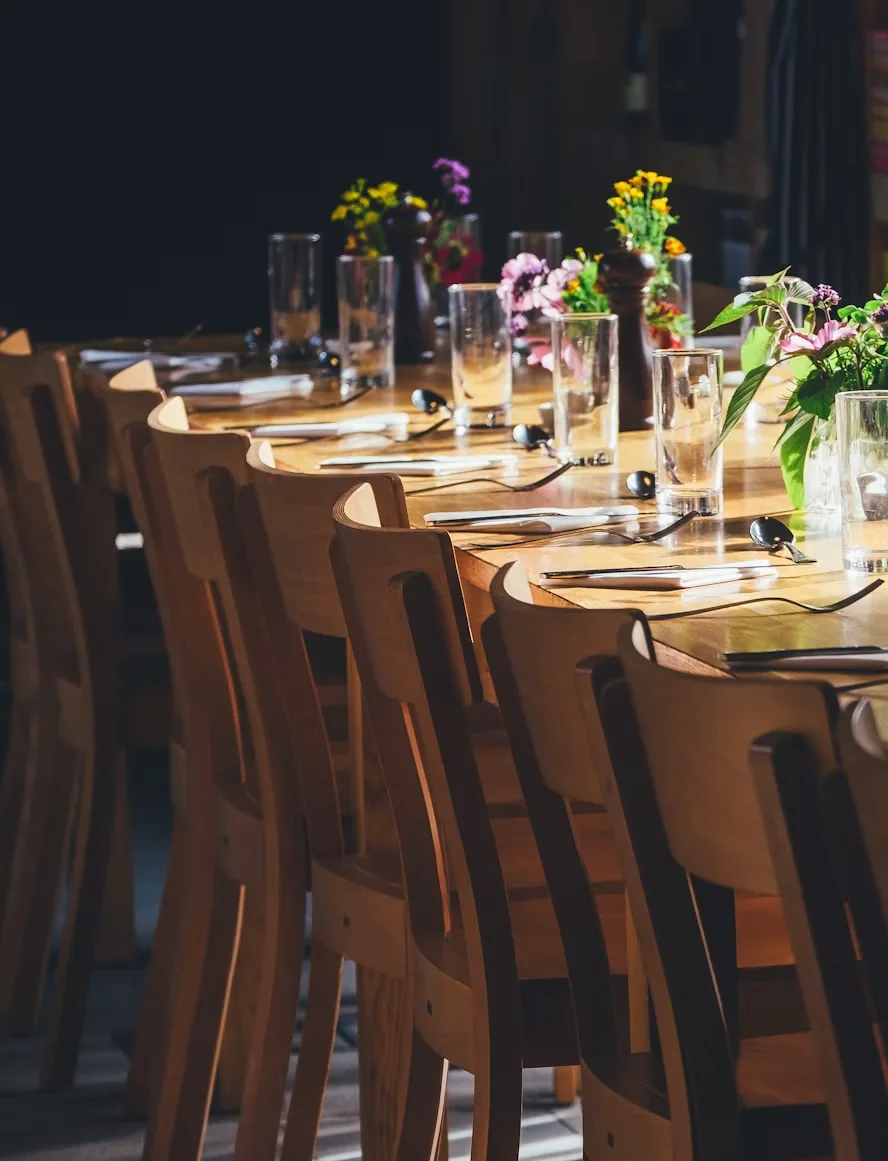A long table set for an evening with guests