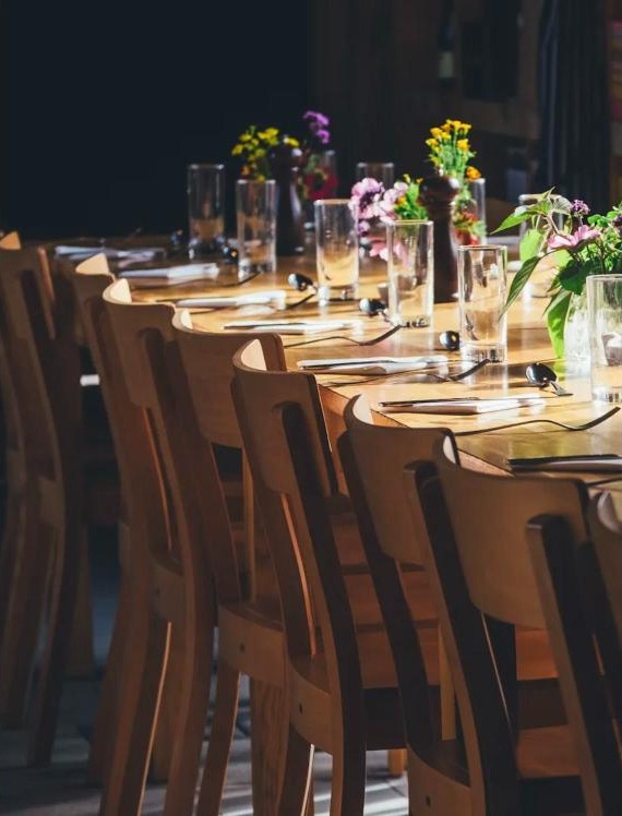 A long table set for an evening with guests